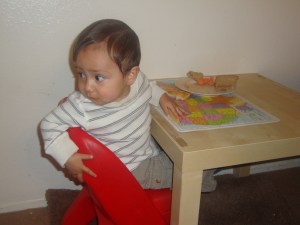toddler turning around on chair