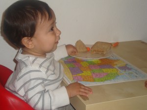 toddler sitting on chair
