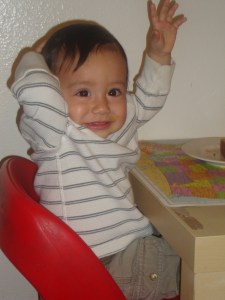 little boy raising his hand
