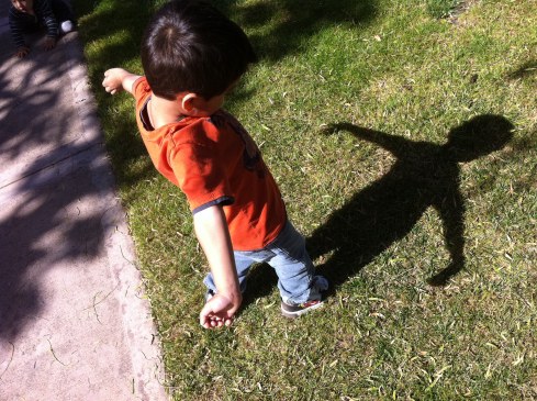 little boy sees his shadow