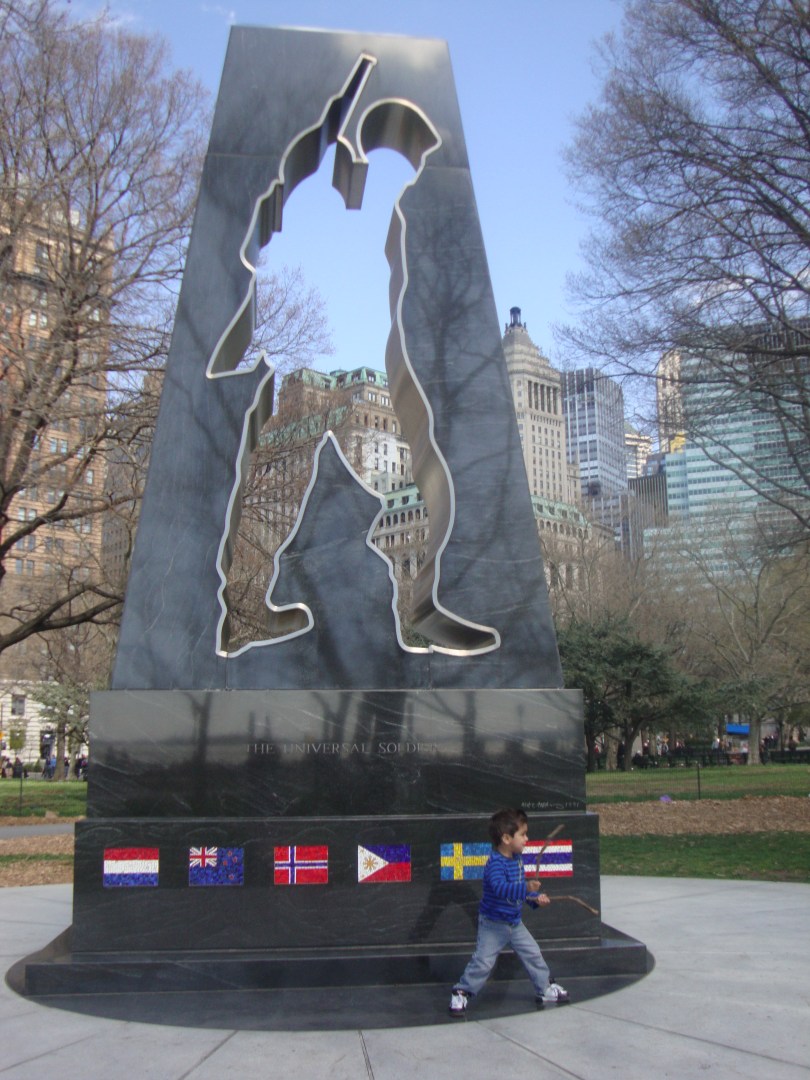 little boy infront of marine memorial