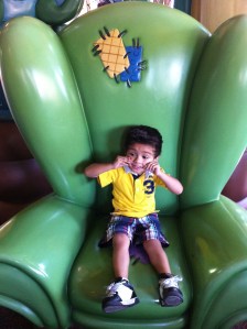 Little boy sitting on chair