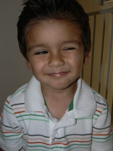 little boy with mischievous  look