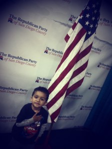 Boy next to USA flag