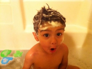 little boy with surprised look little boy in bathtub