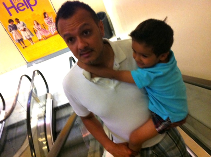 daddy and son on exalator