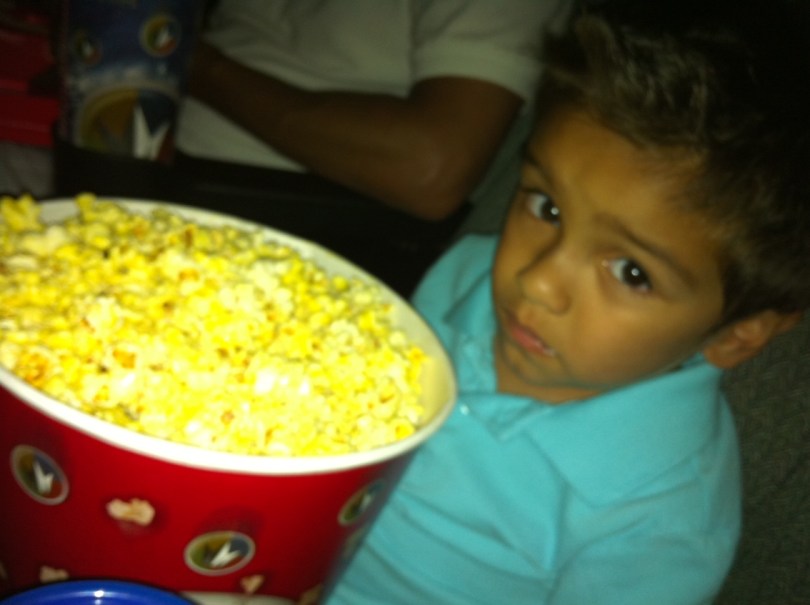 little boy with popcorn