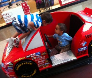 kids playing on a race car