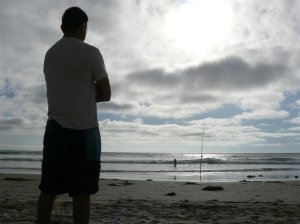man fishing beautiful sky