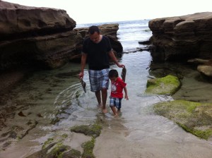 Daddy and son in water father and son in beach