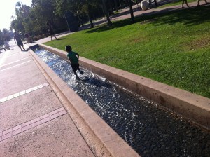 boy runs in water running in water
