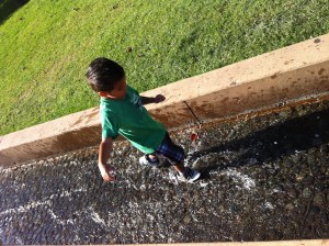 boy splashing water boy playing in water