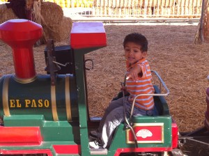 little boy on little train